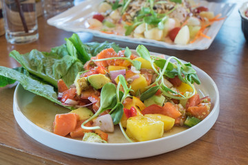Vegetable salad with salmon.