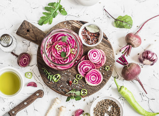 Cooking the pickled beets. Beets and spices on a rustic cutting board on light background