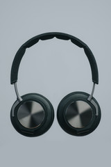 stylish headphones on a gray studio surface isolated black colour