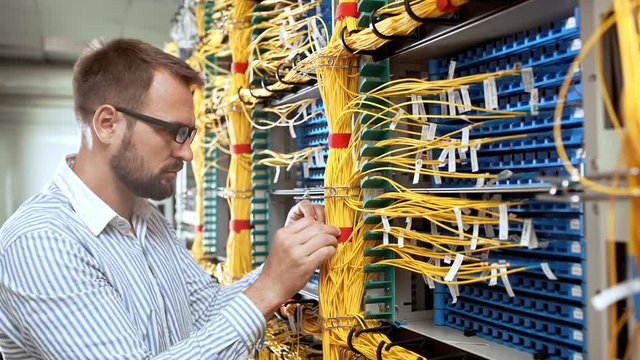 Engineer working in data room.