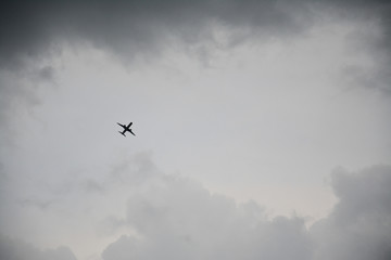 Plane flying in stormy cloud