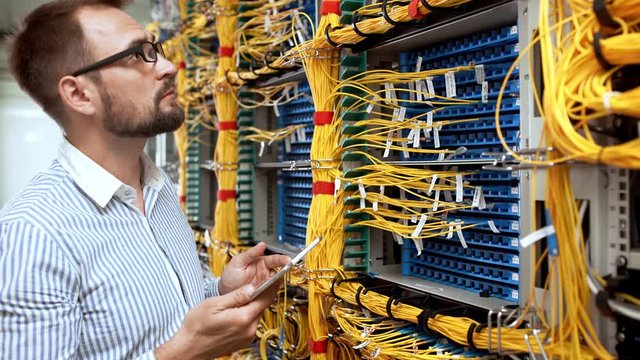 Engineer working in data room.