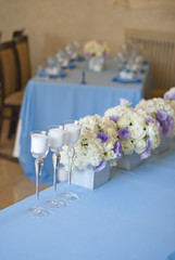 Nicely decorated wedding table with flowers and candles 