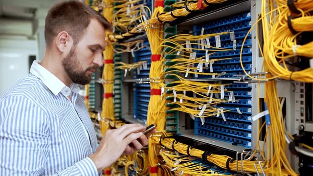 Engineer working in data room.