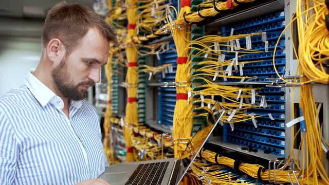 Engineer working in data room.