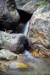 Rocks in stream with flowing water.