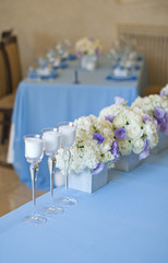 Nicely decorated wedding table with flowers and candles 