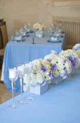 Nicely decorated wedding table with flowers and candles 