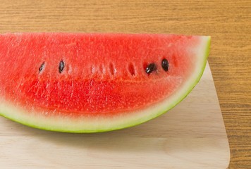 Fresh Ripe Watermelon on A Wooden Board