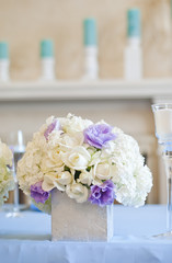Nicely decorated wedding table with flowers and candles 
