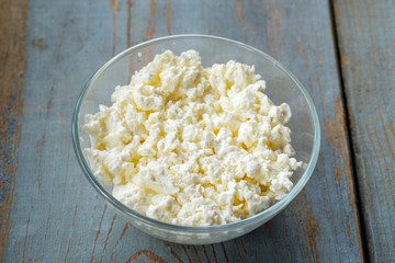 Natural organic cottage cheese in a glass bowl