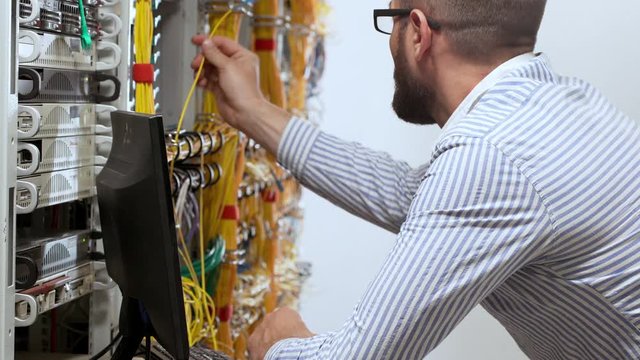 Engineer working in data room.