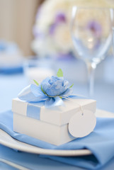 Beautiful bonbonniere with ribbons and flower 