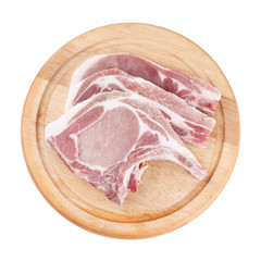Raw pork chop on wooden broad or cooking pork chop steak