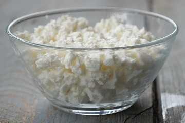 Natural organic cottage cheese in a glass bowl