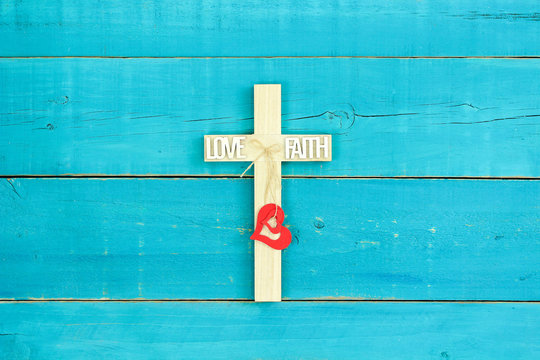 Wood cross with Love, Faith and red hearts