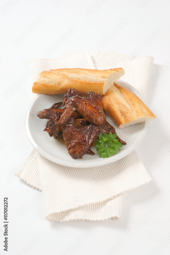 Canvas Prints barbecue chicken wings with crispy baguette