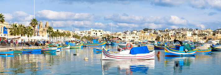 Marsaxlokk fishermen village in Malta. Panoramic view. - obrazy, fototapety, plakaty