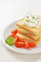 Fototapeta na wymiar toasted white bread and creamy chives spread