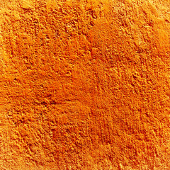 Texture orange plastered wall for background