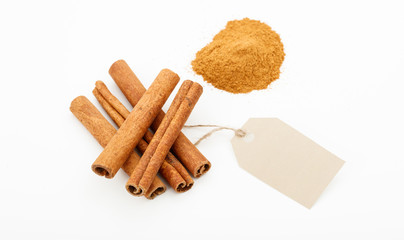 Cinammon sticks and powder on a white background