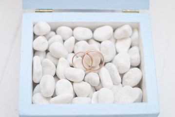 Wedding rings in blue box with white stone.Wedding ceremony 