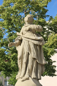 Baroque statue of the Virgin Mary on the Balthasar Neumann Square in Werneck, town in Franconia, Germany. 