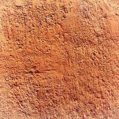 Texture orange plastered wall for background