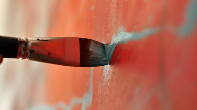An artist is showing some techniques of painting