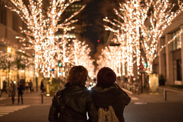 Asian couple with Christmas lights in Marunouchi, Tokyo