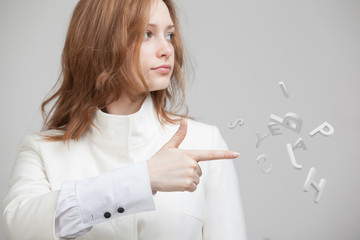 Woman working with a set of letters, writing concept.