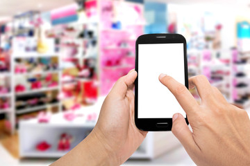 Woman uses a smartphone on shopping in the department store.
