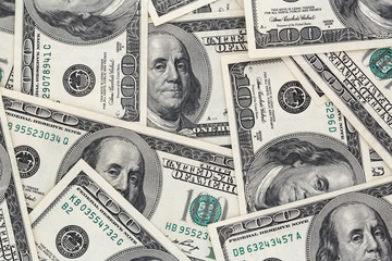 close up of several one hundred dollars banknotes