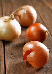 Still life with onions on an old table