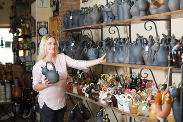 Customer picking black glazed crockery