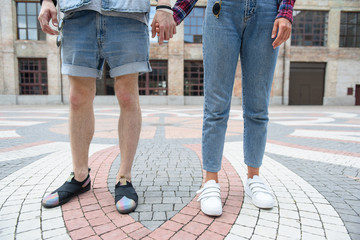 Naklejka premium Young hipsters walking in town