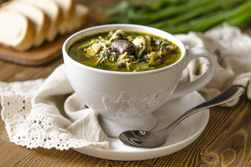 Soup with mushrooms paste offal carrots and herbs  