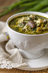Soup with mushrooms paste offal carrots and herbs  
