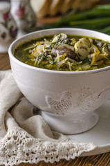 Soup with mushrooms paste offal carrots and herbs  