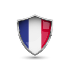 National flag of France. Flag on the metal shield with glare.