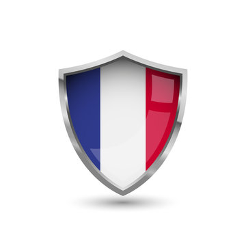 National flag of France. Flag on the metal shield with glare.