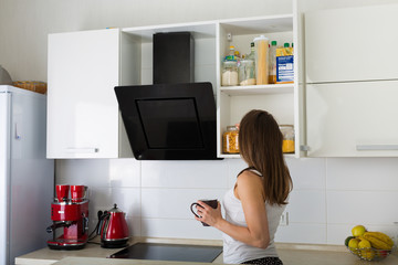 Woman at her kitchen in the morning