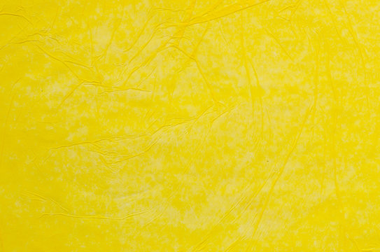 Creased Yellow Tissue Paper Background