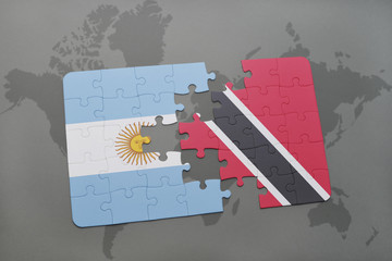 puzzle with the national flag of argentina and trinidad and tobago on a world map background.