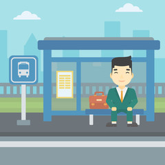 Man waiting for bus at the bus stop.