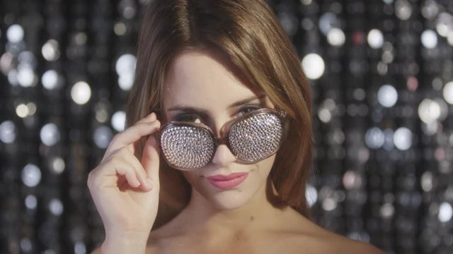sexy disco woman with silver diamond sunglasses