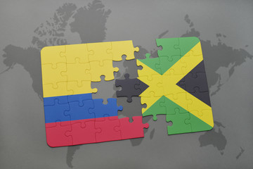 puzzle with the national flag of colombia and jamaica on a world map background.