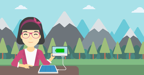 Solar panel charging tablet computer.