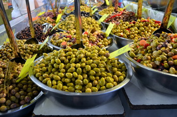 Bowls of olives for sale at a market in france