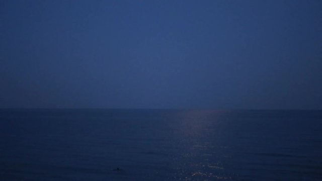 Moonbeam on Waves in Sea in Twilight